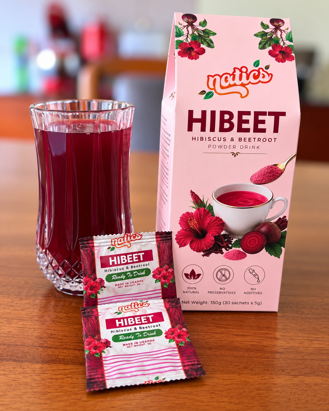 Natics HiBeet hibiscus and beetroot powder drink box and sachets with a glass of prepared HiBeet